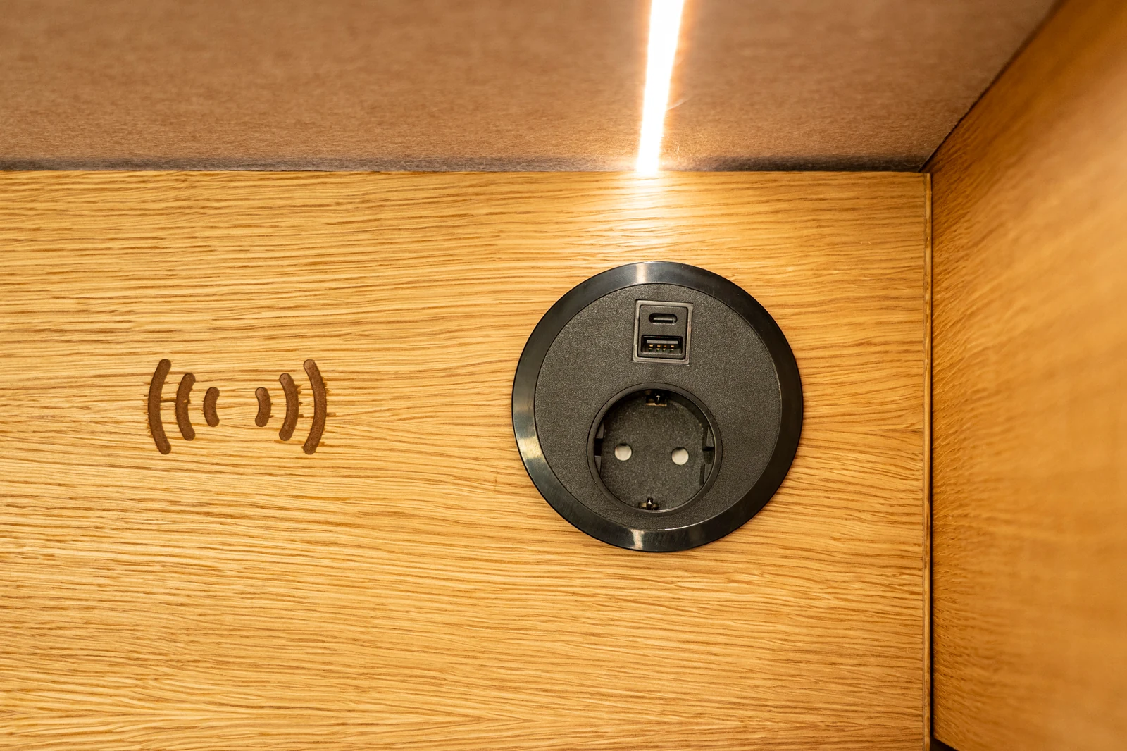 Shelf and charging detail. European socket shown; request the UK socket configuration.